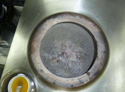 Looking down into a Tandoori oven at Bombay Grill