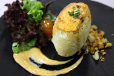 Spanish potato omelette in wheat roll with mayonnaise of “Piquillo” pepper