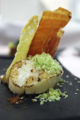 Scallops Galician style set on tomato sauce, parsley mini croutons and Pata Negra ham powder