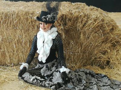 A total outfit developed by a student for a completion she had entered. ‘Bustle’ skirt with train, Jabot frills, cuffs and fabric ‘boot covers.  She claimed 1st prize!